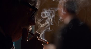 Movie still from “Trumbo” (2015), directed by Jay Roach – A man smoking a cigarette in front of a mirror; Extreme Close Up shot, Over the shoulder angle