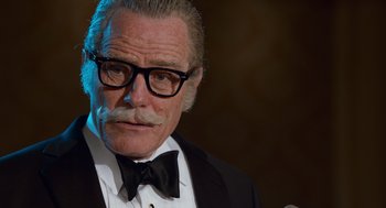 Movie still from “Trumbo” (2015), directed by Jay Roach – An older man in a suit and bow tie; Close Up shot, Low angle