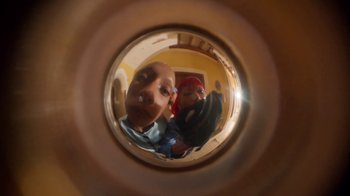 Movie still from “H&M - Hotel Hennes” (2022) – Extreme Close Up shot, Overhead angle