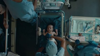 Movie still from “Huggies - Welcome to the World, Baby” (2021) – Medium shot, Overhead angle