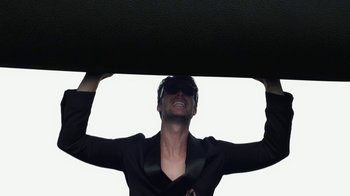 Movie still from “Emporio Armani - SS24 Campaign” (2024) – Medium shot, Low angle