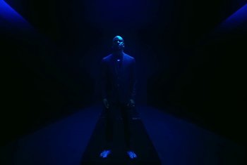 Movie still from “Nike - Skepta SkAir Air Max Tailwind V” (2021) – Wide shot, Low angle
