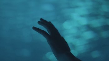 Movie still from “Katie Glasgow – “Saint”” (2021), directed by Georgia Krause – Extreme Close Up shot, Overhead angle