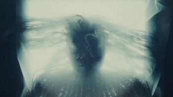 Movie still from “Abby T - Legos ft. Rodney Chrome” (2021), directed by Henry DaCosta – Extreme Close Up shot, Overhead angle