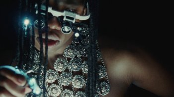 Movie still from “Abby T - Legos ft. Rodney Chrome” (2021), directed by Henry DaCosta – Extreme Close Up shot, Low angle