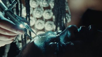 Movie still from “Abby T - Legos ft. Rodney Chrome” (2021), directed by Henry DaCosta – Extreme Close Up shot, High angle