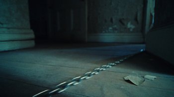 Movie still from “Abby T - Legos ft. Rodney Chrome” (2021), directed by Henry DaCosta – Extreme Close Up shot, High angle