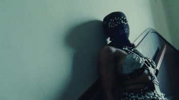 Movie still from “Abby T - Legos ft. Rodney Chrome” (2021), directed by Henry DaCosta – Medium shot, Overhead angle