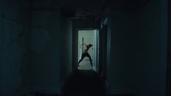 Movie still from “Abby T - Legos ft. Rodney Chrome” (2021), directed by Henry DaCosta – Wide shot, Low angle