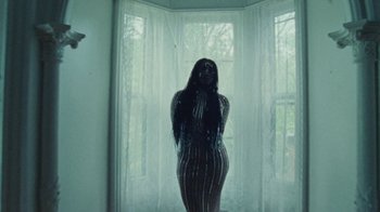 Movie still from “Abby T - Legos ft. Rodney Chrome” (2021), directed by Henry DaCosta – Medium shot, Low angle