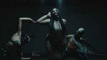 Movie still from “Abby T - Legos ft. Rodney Chrome” (2021), directed by Henry DaCosta – Medium shot, Low angle