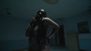 Movie still from “Abby T - Legos ft. Rodney Chrome” (2021), directed by Henry DaCosta – Medium shot, Low angle