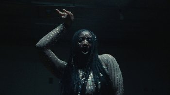 Movie still from “Abby T - Legos ft. Rodney Chrome” (2021), directed by Henry DaCosta – Close Up shot, Low angle