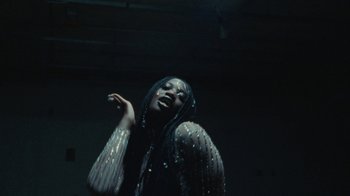 Movie still from “Abby T - Legos ft. Rodney Chrome” (2021), directed by Henry DaCosta – Close Up shot, Low angle