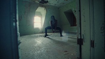 Movie still from “Abby T - Legos ft. Rodney Chrome” (2021), directed by Henry DaCosta – Wide shot, Low angle