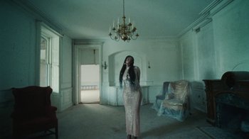 Movie still from “Abby T - Legos ft. Rodney Chrome” (2021), directed by Henry DaCosta – Wide shot, Low angle