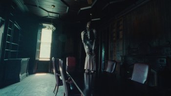 Movie still from “Abby T - Legos ft. Rodney Chrome” (2021), directed by Henry DaCosta – Wide shot, Low angle