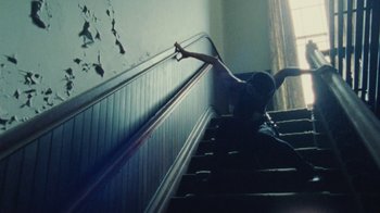 Movie still from “Abby T - Legos ft. Rodney Chrome” (2021), directed by Henry DaCosta – Wide shot, Low angle