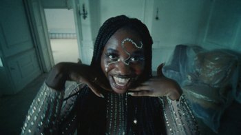 Movie still from “Abby T - Legos ft. Rodney Chrome” (2021), directed by Henry DaCosta – Close Up shot, Low angle