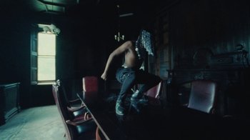 Movie still from “Abby T - Legos ft. Rodney Chrome” (2021), directed by Henry DaCosta – Wide shot, Low angle