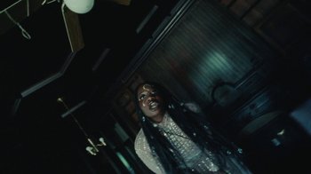 Movie still from “Abby T - Legos ft. Rodney Chrome” (2021), directed by Henry DaCosta – Medium shot, Low angle