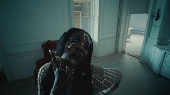 Movie still from “Abby T - Legos ft. Rodney Chrome” (2021), directed by Henry DaCosta – Close Up shot, High angle