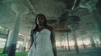 Movie still from “Abby T - Legos ft. Rodney Chrome” (2021), directed by Henry DaCosta – Medium shot, Low angle