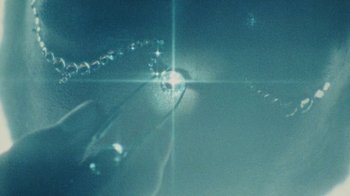 Movie still from “Abby T - Legos ft. Rodney Chrome” (2021), directed by Henry DaCosta – Extreme Close Up shot, High angle