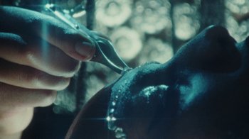 Movie still from “Abby T - Legos ft. Rodney Chrome” (2021), directed by Henry DaCosta – Extreme Close Up shot, High angle