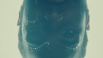 Movie still from “Abby T - Legos ft. Rodney Chrome” (2021), directed by Henry DaCosta – Extreme Close Up shot, Overhead angle