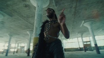 Movie still from “Abby T - Legos ft. Rodney Chrome” (2021), directed by Henry DaCosta – Medium shot, Low angle