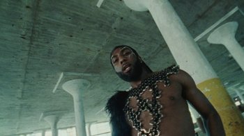 Movie still from “Abby T - Legos ft. Rodney Chrome” (2021), directed by Henry DaCosta – Medium shot, Low angle