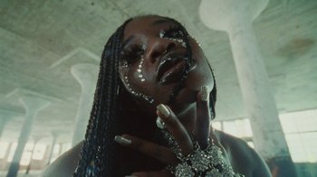 Movie still from “Abby T - Legos ft. Rodney Chrome” (2021), directed by Henry DaCosta – Extreme Close Up shot, High angle