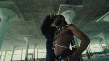 Movie still from “Abby T - Legos ft. Rodney Chrome” (2021), directed by Henry DaCosta – Medium shot, Low angle