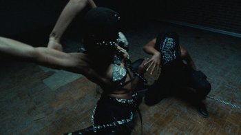 Movie still from “Abby T - Legos ft. Rodney Chrome” (2021), directed by Henry DaCosta – Medium shot, Overhead angle