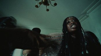 Movie still from “Abby T - Legos ft. Rodney Chrome” (2021), directed by Henry DaCosta – Close Up shot, Low angle