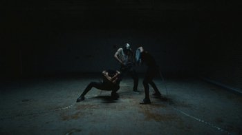 Movie still from “Abby T - Legos ft. Rodney Chrome” (2021), directed by Henry DaCosta – Wide shot, Low angle