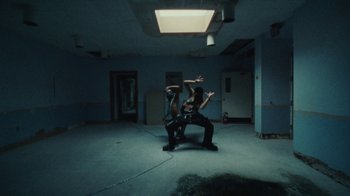 Movie still from “Abby T - Legos ft. Rodney Chrome” (2021), directed by Henry DaCosta – Wide shot, Low angle