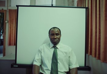 Movie still from “Stromae - Santé” (2021), directed by Jara Moravec – Medium shot, Low angle