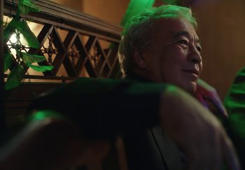 Movie still from “Stromae - Santé” (2021), directed by Jara Moravec – Close Up shot, Low angle