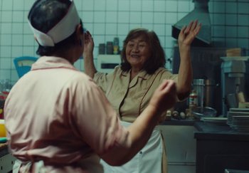 Movie still from “Stromae - Santé” (2021), directed by Jara Moravec – Medium shot, Low angle