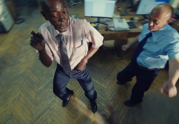 Movie still from “Stromae - Santé” (2021), directed by Jara Moravec – Medium shot, High angle