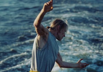 Movie still from “Stromae - Santé” (2021), directed by Jara Moravec – Medium shot, Low angle