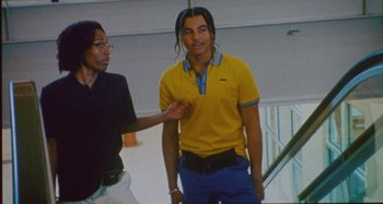 Movie still from “24kGoldn & Lil Tecca - Prada” (2021), directed by John Tashiro – Medium shot, Low angle