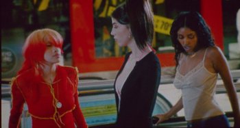 Movie still from “24kGoldn & Lil Tecca - Prada” (2021), directed by John Tashiro – Medium shot, Low angle