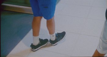 Movie still from “24kGoldn & Lil Tecca - Prada” (2021), directed by John Tashiro – Extreme Close Up shot, High angle