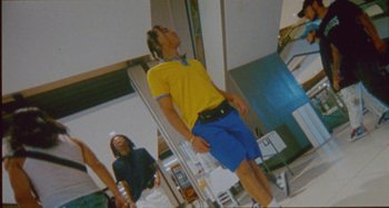 Movie still from “24kGoldn & Lil Tecca - Prada” (2021), directed by John Tashiro – Wide shot, Low angle