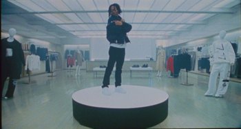 Movie still from “24kGoldn & Lil Tecca - Prada” (2021), directed by John Tashiro – Wide shot, Low angle