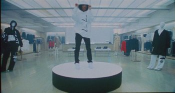 Movie still from “24kGoldn & Lil Tecca - Prada” (2021), directed by John Tashiro – Wide shot, Overhead angle