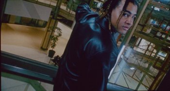 Movie still from “24kGoldn & Lil Tecca - Prada” (2021), directed by John Tashiro – Medium shot, Low angle